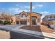 Two-story home with three-car garage and beautiful desert landscaping at 2743 Carolina Blue Ave, Henderson, NV 89052