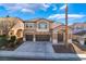 Inviting two-story home with a well-manicured lawn and three-car garage, presenting a classic suburban charm at 2743 Carolina Blue Ave, Henderson, NV 89052