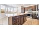 A kitchen featuring granite countertops, dark cabinets, and stainless steel appliances at 2743 Carolina Blue Ave, Henderson, NV 89052