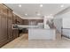 Open kitchen boasts stainless steel appliances, granite countertops, and a large center island at 2743 Carolina Blue Ave, Henderson, NV 89052