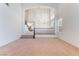 Bright, open-plan living room featuring high ceilings, a grand staircase, and large windows for ample natural light at 2743 Carolina Blue Ave, Henderson, NV 89052