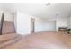 Inviting living room with a corner fireplace, large windows, and convenient access to the staircase at 2743 Carolina Blue Ave, Henderson, NV 89052