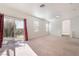 Large living room has carpet, multiple windows and sliding glass doors at 2743 Carolina Blue Ave, Henderson, NV 89052