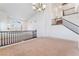 Spacious living room showcasing high ceilings, staircase, and a view of the home's entry at 2743 Carolina Blue Ave, Henderson, NV 89052