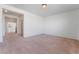 Spacious carpeted living room with multiple entry points at 2743 Carolina Blue Ave, Henderson, NV 89052