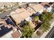 A high angle view from above the home featuring a well landscaped backyard and covered patio at 2743 Carolina Blue Ave, Henderson, NV 89052