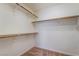 Simple walk-in closet with carpet and white walls and shelving at 2743 Carolina Blue Ave, Henderson, NV 89052