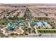 The aerial shot highlights the community pool, playground, and well-maintained landscaping in the neighborhood at 2785 Donatello Manor Pl, Henderson, NV 89044