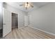 A comfortable bedroom has a ceiling fan, and doors to the closet and bathroom at 2785 Donatello Manor Pl, Henderson, NV 89044