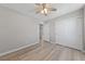 Bedroom features wood-look floors, ceiling fan, and a double-door closet at 2785 Donatello Manor Pl, Henderson, NV 89044