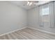 This bedroom features a ceiling fan and a large window with a curtain at 2785 Donatello Manor Pl, Henderson, NV 89044