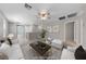 Upstairs living room with a neutral palette and modern decor creates a cozy and inviting atmosphere at 2785 Donatello Manor Pl, Henderson, NV 89044