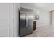 Kitchen area featuring stainless steel refrigerator and tiled flooring at 2785 Donatello Manor Pl, Henderson, NV 89044