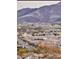 Distant view of a suburban neighborhood, with mountains in the background, showcasing a peaceful setting at 2844 Alenga St, Henderson, NV 89044