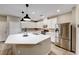 Bright kitchen with stainless steel appliances and large center island at 2844 Alenga St, Henderson, NV 89044