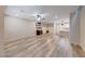 Spacious living room boasts hardwood floors, neutral paint and an open concept layout for easy flow and natural light at 2844 Alenga St, Henderson, NV 89044