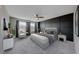 Spacious main bedroom features a stylish accent wall, plush carpeting, and large windows for natural light at 2844 Alenga St, Henderson, NV 89044