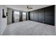 Stylish main bedroom with gray carpet, sleek modern decor, and large windows; perfect for relaxation and comfort at 2844 Alenga St, Henderson, NV 89044