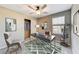 Well-lit home office with a ceiling fan, closet, desk, and decorative shelves, ideal for a productive workspace at 2844 Alenga St, Henderson, NV 89044