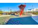 A well-equipped playground features slides and climbing structures, providing a safe and engaging recreational space for children at 2844 Alenga St, Henderson, NV 89044