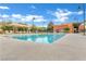 Community pool with shaded lounge area offers a relaxing space for residents and guests at 2844 Alenga St, Henderson, NV 89044
