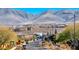 Residential street view showcasing a neighborhood with mountain views in the distance and well-maintained landscaping at 2844 Alenga St, Henderson, NV 89044