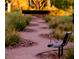 Scenic walking path with bench seating offers a serene outdoor space for relaxation and leisure at 2844 Alenga St, Henderson, NV 89044