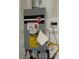 Rheem tankless water heater installation with visible connections and energy guide at 2844 Alenga St, Henderson, NV 89044