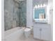 Bathroom featuring a luxurious tub and tiled shower with modern fixtures and tiling at 3008 Lawndale St, Las Vegas, NV 89121