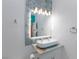Contemporary bathroom boasting hexagon tile, a sleek mirror and modern vessel sink at 3008 Lawndale St, Las Vegas, NV 89121