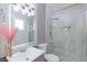 Modern bathroom featuring a glass shower and illuminated mirror at 3008 Lawndale St, Las Vegas, NV 89121