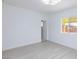 Sunlit bedroom with light floors, an overhead light, and views to the outside at 3008 Lawndale St, Las Vegas, NV 89121