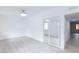 Bright and airy bedroom features wood-look floors and a mirrored closet at 3008 Lawndale St, Las Vegas, NV 89121
