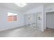 Spacious bedroom with a mirrored closet, wood-look floors, and natural light at 3008 Lawndale St, Las Vegas, NV 89121