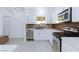 Modern kitchen with stainless steel appliances, white cabinets, and bright modern lighting at 3008 Lawndale St, Las Vegas, NV 89121