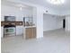 A well lit kitchen with stainless steel appliances and a decorative backsplash at 3008 Lawndale St, Las Vegas, NV 89121