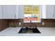 Modern kitchen sink with marble countertop and natural backsplash at 3008 Lawndale St, Las Vegas, NV 89121