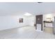 Expansive living space connecting to a bright kitchen, featuring modern design at 3008 Lawndale St, Las Vegas, NV 89121
