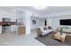Open-concept floor plan with bright living room next to kitchen with stainless appliances at 3008 Lawndale St, Las Vegas, NV 89121