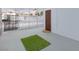 Enclosed patio space with patterned metal fencing and an artificial turf rug outside the door at 3008 Lawndale St, Las Vegas, NV 89121