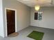 Indoor room featuring a chandelier, gray walls, and a dark wooden door at 3008 Lawndale St, Las Vegas, NV 89121