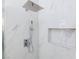 Contemporary shower with marble-look tiles, rainfall showerhead, and convenient niche at 3008 Lawndale St, Las Vegas, NV 89121