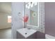 Chic vanity featuring an illuminated mirror and decorative accents at 3008 Lawndale St, Las Vegas, NV 89121