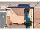 Aerial view of the home featuring desert landscaping, pool and fire pit at 304 Jolly January Ave, Las Vegas, NV 89183