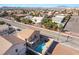 Home featuring a private pool, lounge chairs, fire pit, covered patio and desert landscaping at 304 Jolly January Ave, Las Vegas, NV 89183