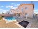 Backyard pool with built-in steps, lounge chairs, fenced perimeter, and low-maintenance landscaping create an inviting retreat at 304 Jolly January Ave, Las Vegas, NV 89183