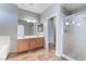 A bright bathroom with a double vanity, shower and separate tub offers a luxurious experience at 304 Jolly January Ave, Las Vegas, NV 89183