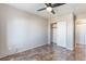 Neutral bedroom features hard floors, ceiling fan, closet, and white walls at 304 Jolly January Ave, Las Vegas, NV 89183