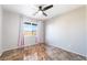 A bright and airy bedroom features neutral-colored walls and a window with stylish curtains at 304 Jolly January Ave, Las Vegas, NV 89183