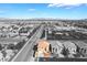 Charming home boasting a well-maintained yard, complemented by a sunny sky and a picturesque cityscape backdrop at 304 Jolly January Ave, Las Vegas, NV 89183